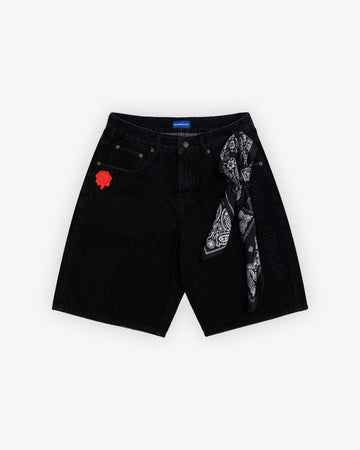 Black denim shorts with a rose patch and bandana on a white background