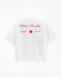 White t-shirt with red text and logo on a white background