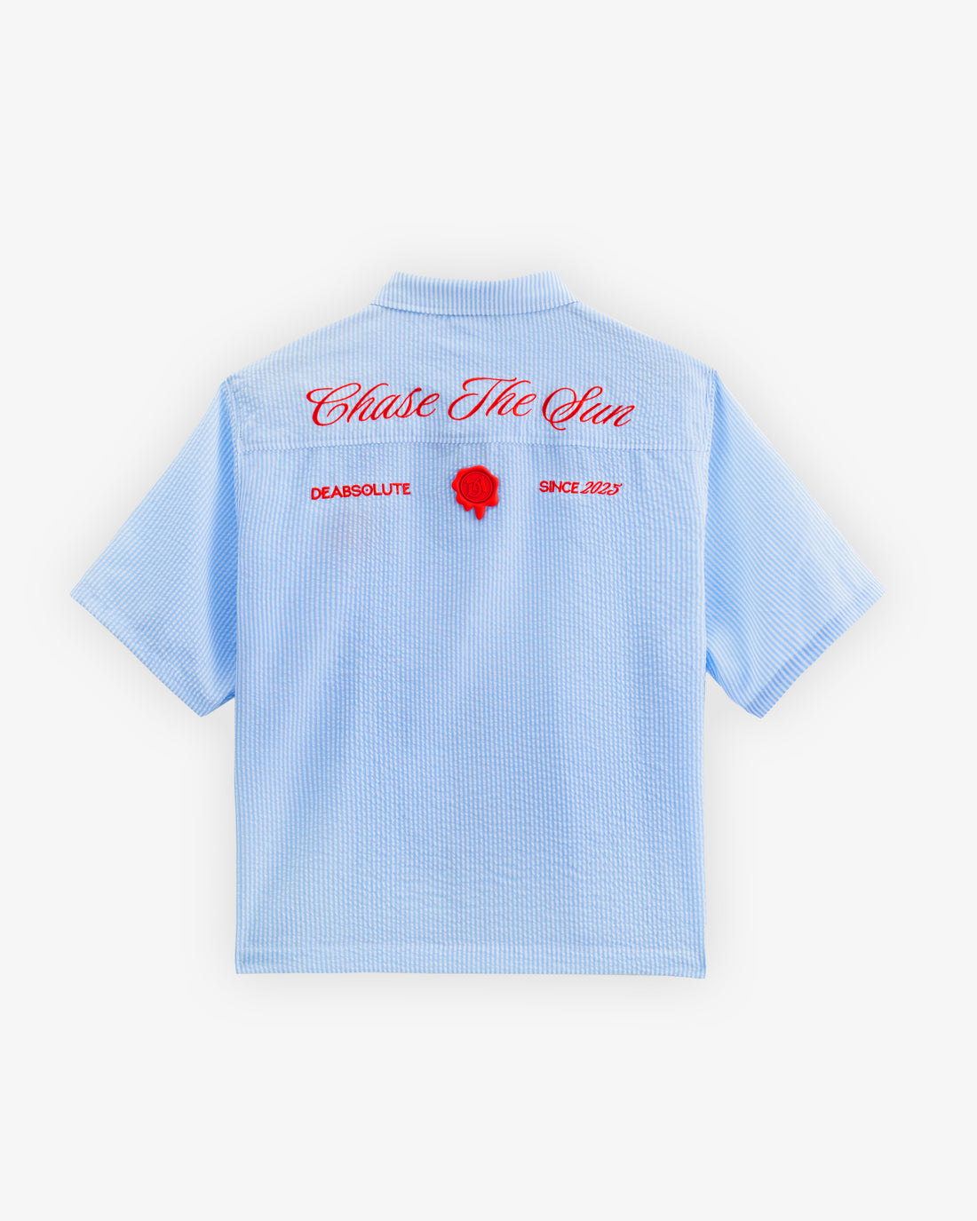 Light blue checkered shirt with a red logo on a white background